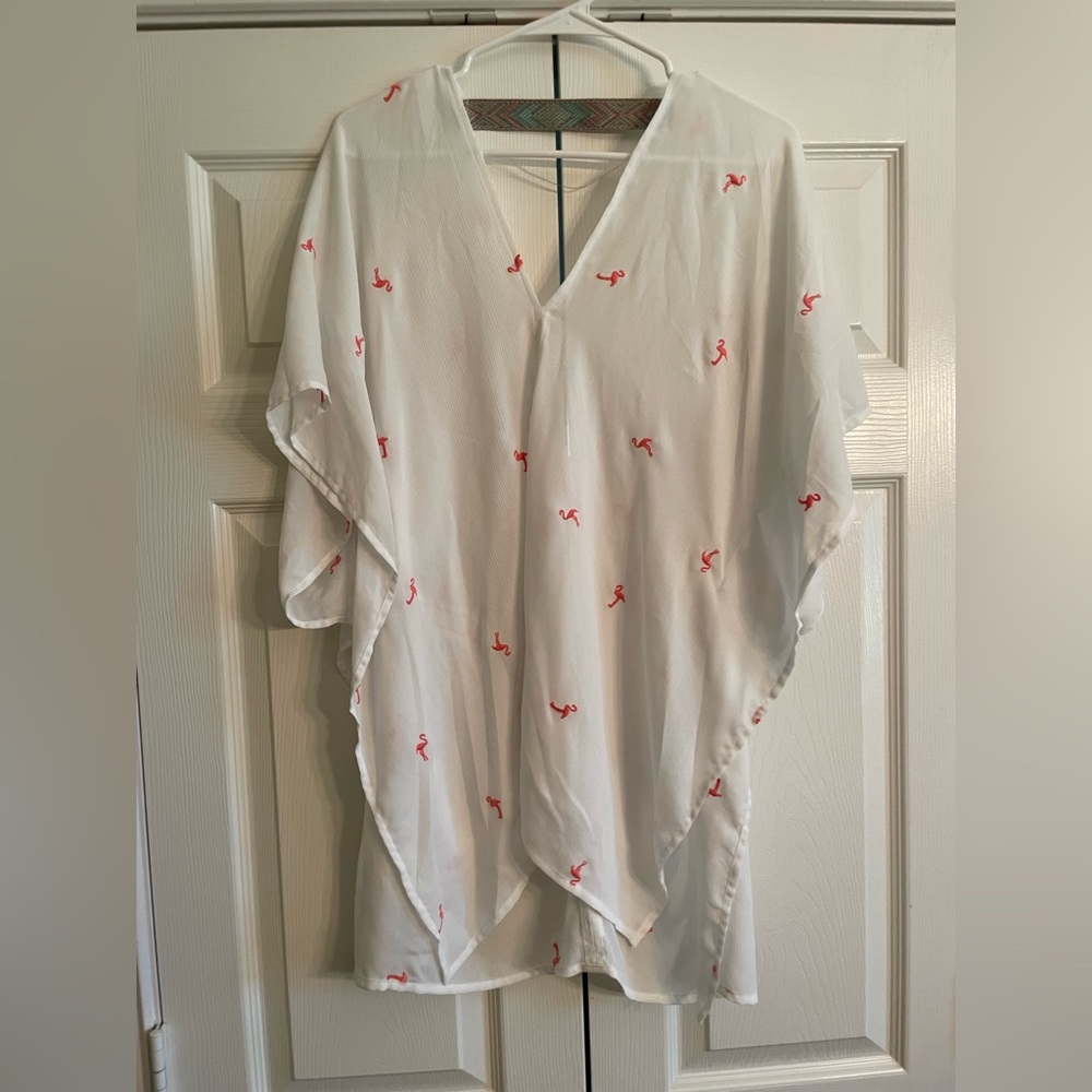 White loose fitting cover up with flamingos on it